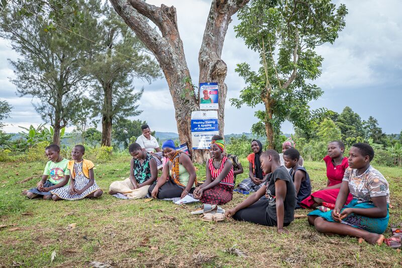 A group sits in a family planning education session in Uganda.